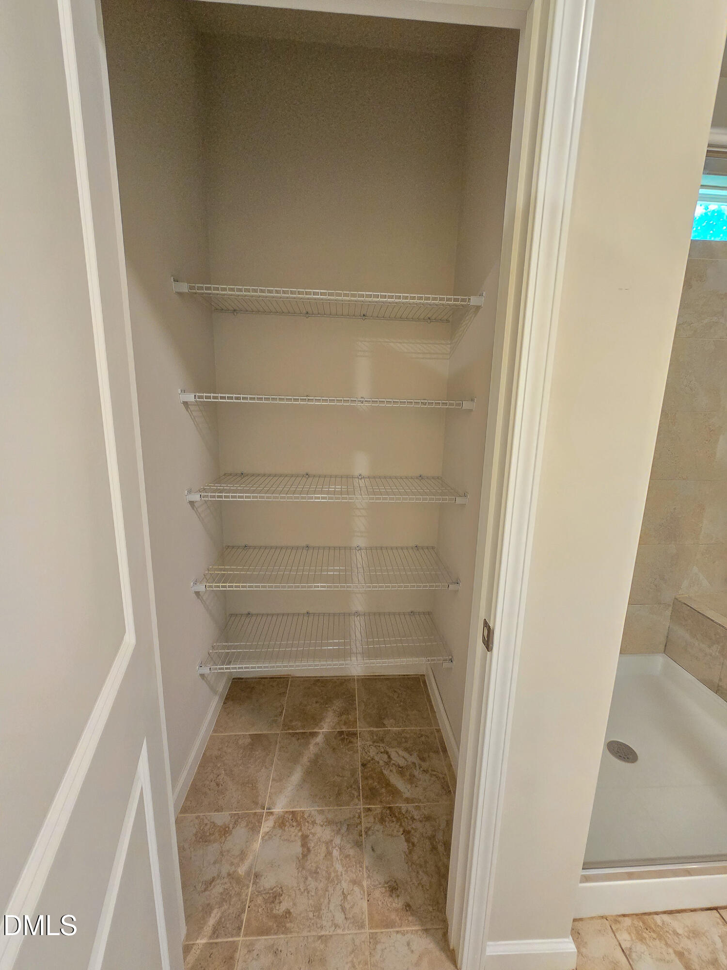 6145 Beale Loop Raleigh, NC 27616 - Photo 25 of 36 a bathroom with a glass door shower