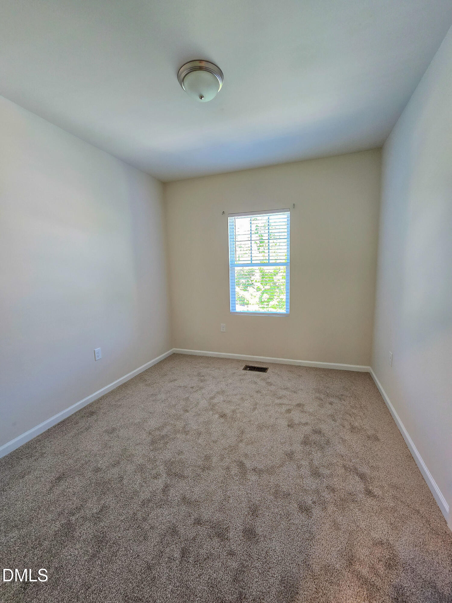 6145 Beale Loop Raleigh, NC 27616 - Photo 26 of 36 an empty room with a window