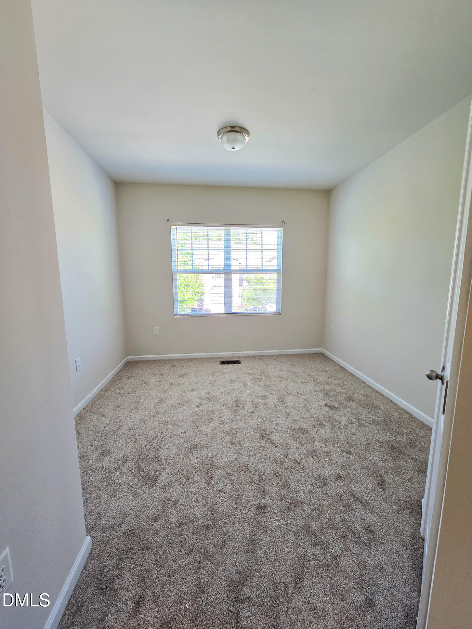 6145 Beale Loop Raleigh, NC 27616 - Photo 30 of 36 an empty room with windows