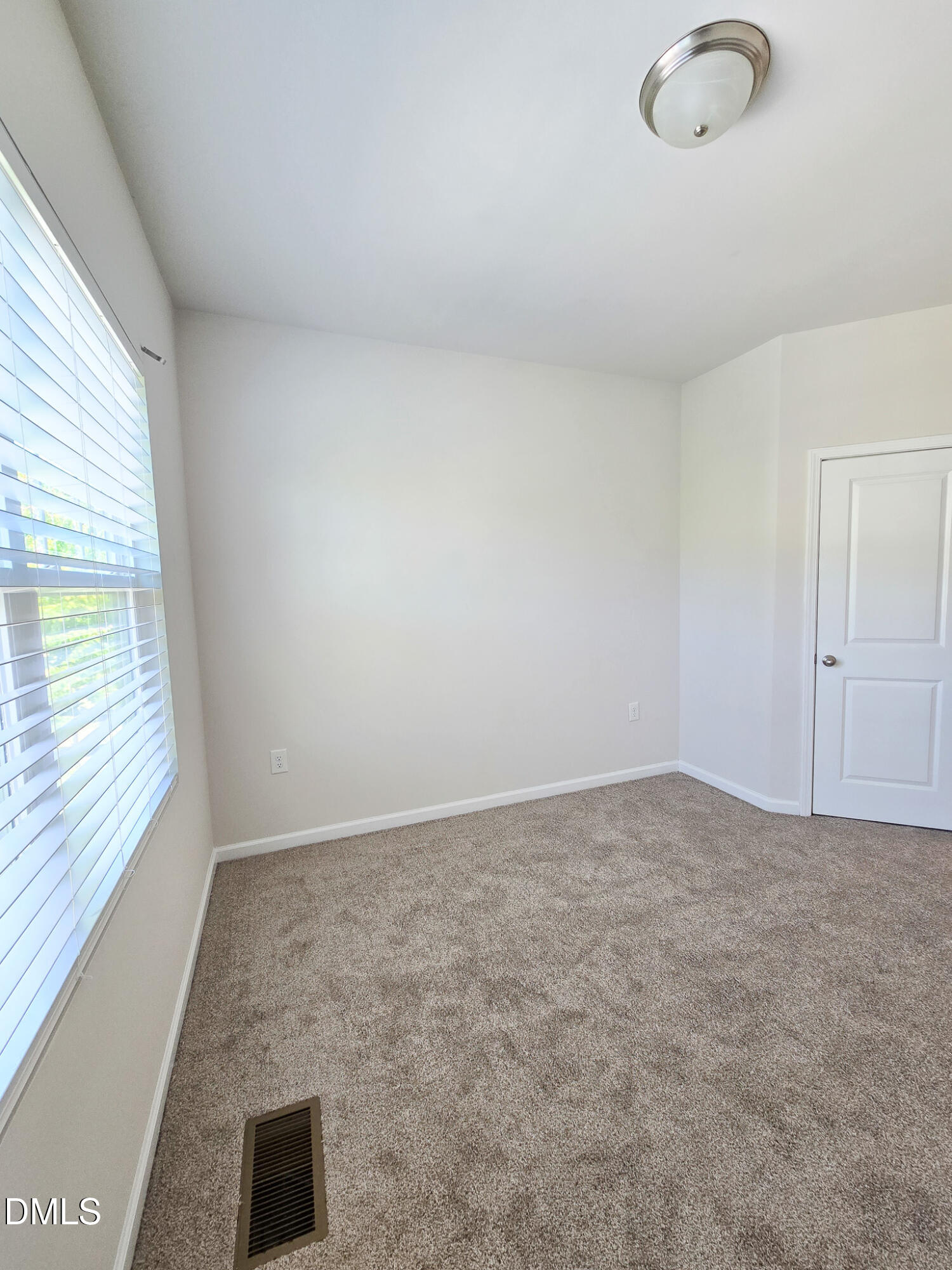 6145 Beale Loop Raleigh, NC 27616 - Photo 31 of 36 a view of an empty room with a window