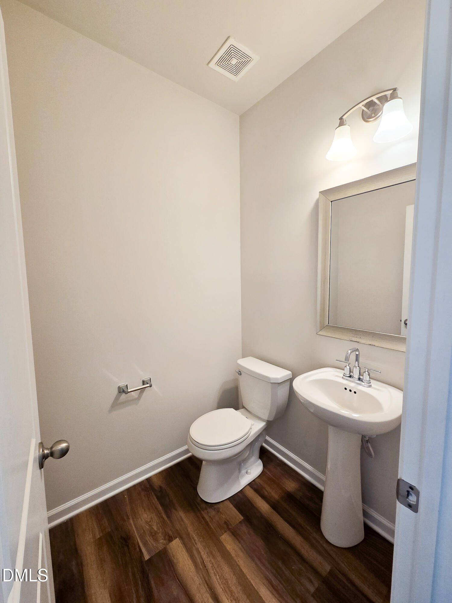 6145 Beale Loop Raleigh, NC 27616 - Photo 5 of 36 a bathroom with a sink toilet and a mirror
