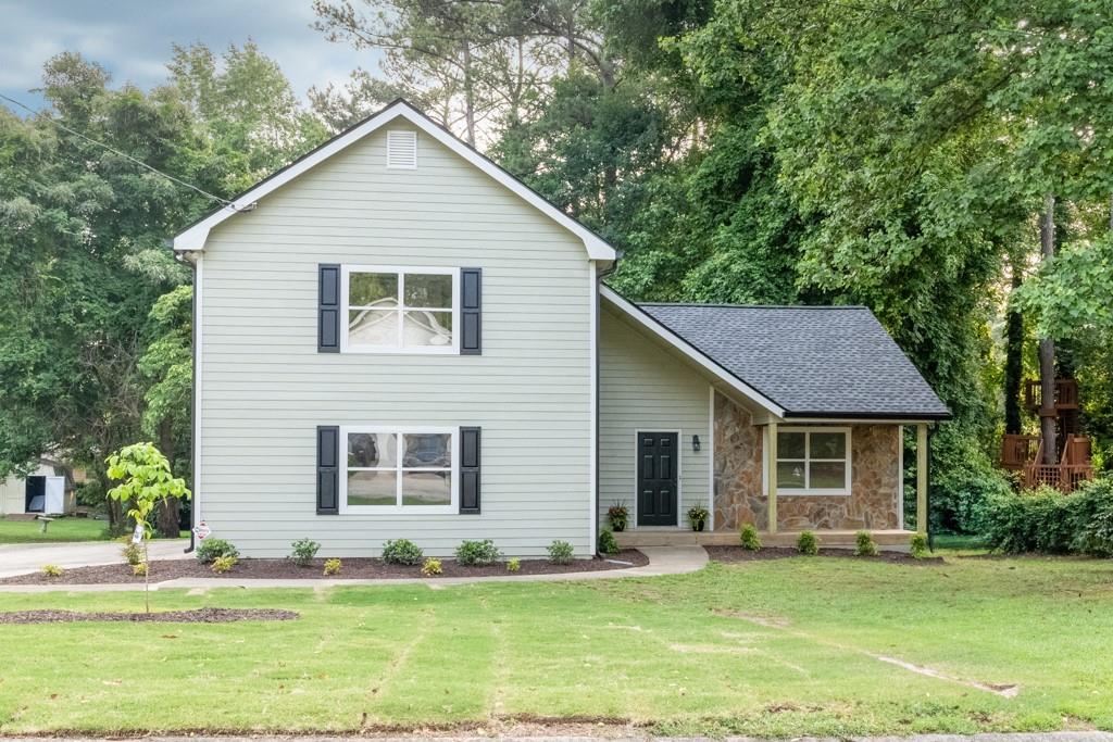 a front view of a house with a yard
