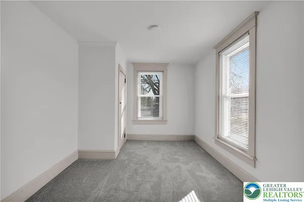 a view of an empty room with a window