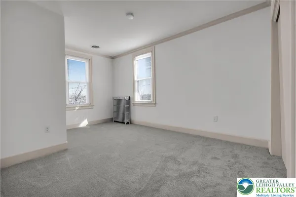 an empty room with windows