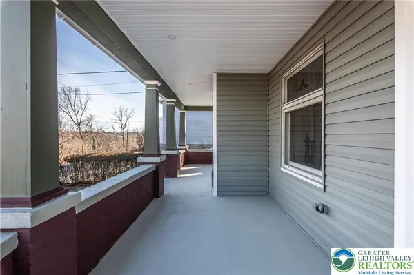 a view of two chairs in the balcony