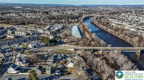 an aerial view of a house with outdoor space