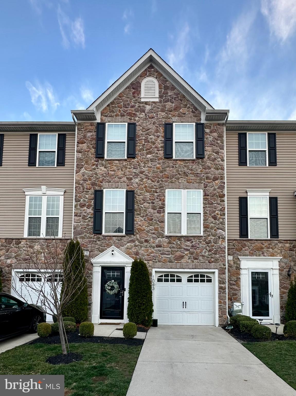 a front view of a house with yard
