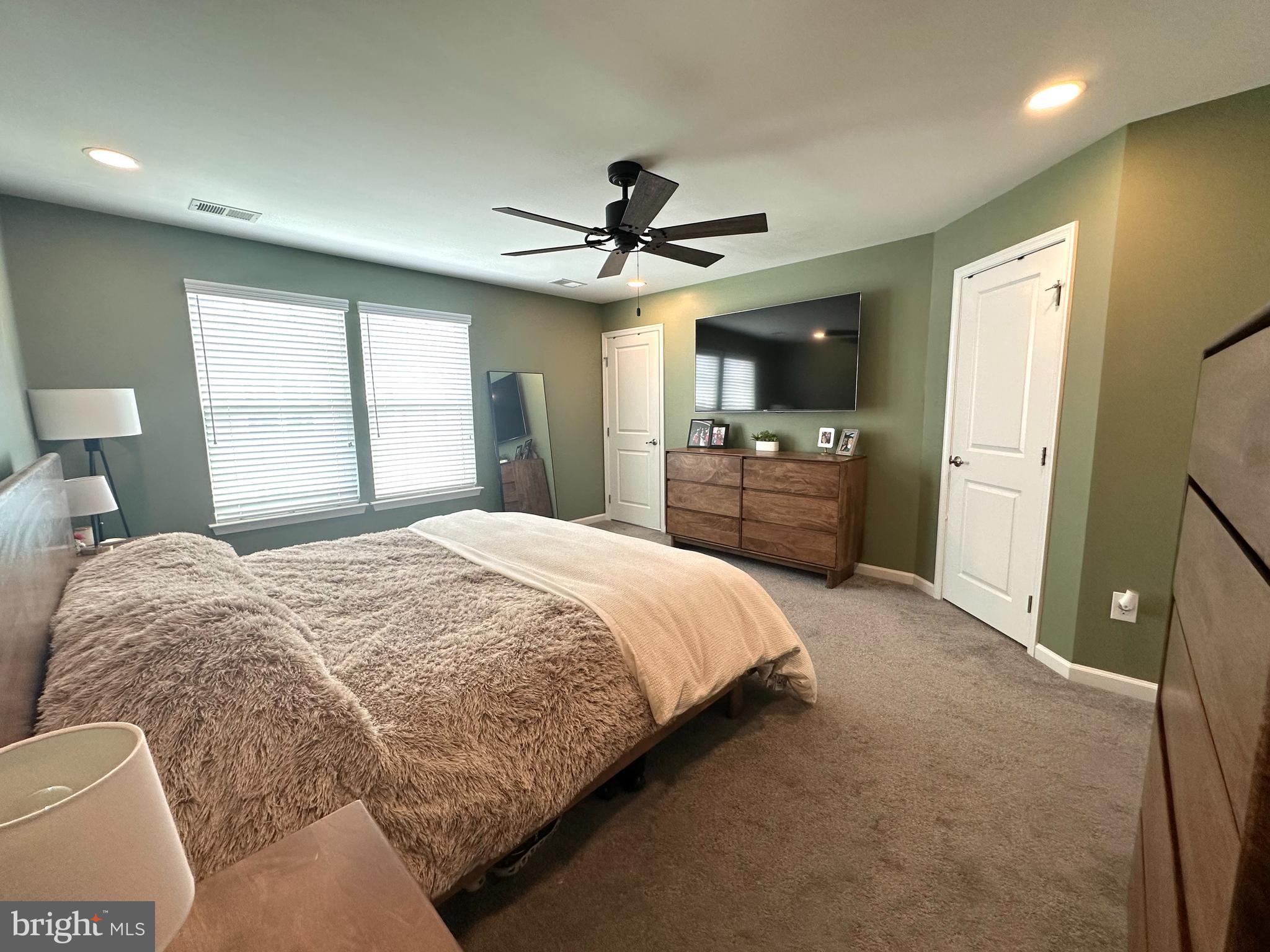 1043 Regency Place Sewell, NJ 08080 - Photo 12 of 24 a spacious bedroom with a bed and a chandelier