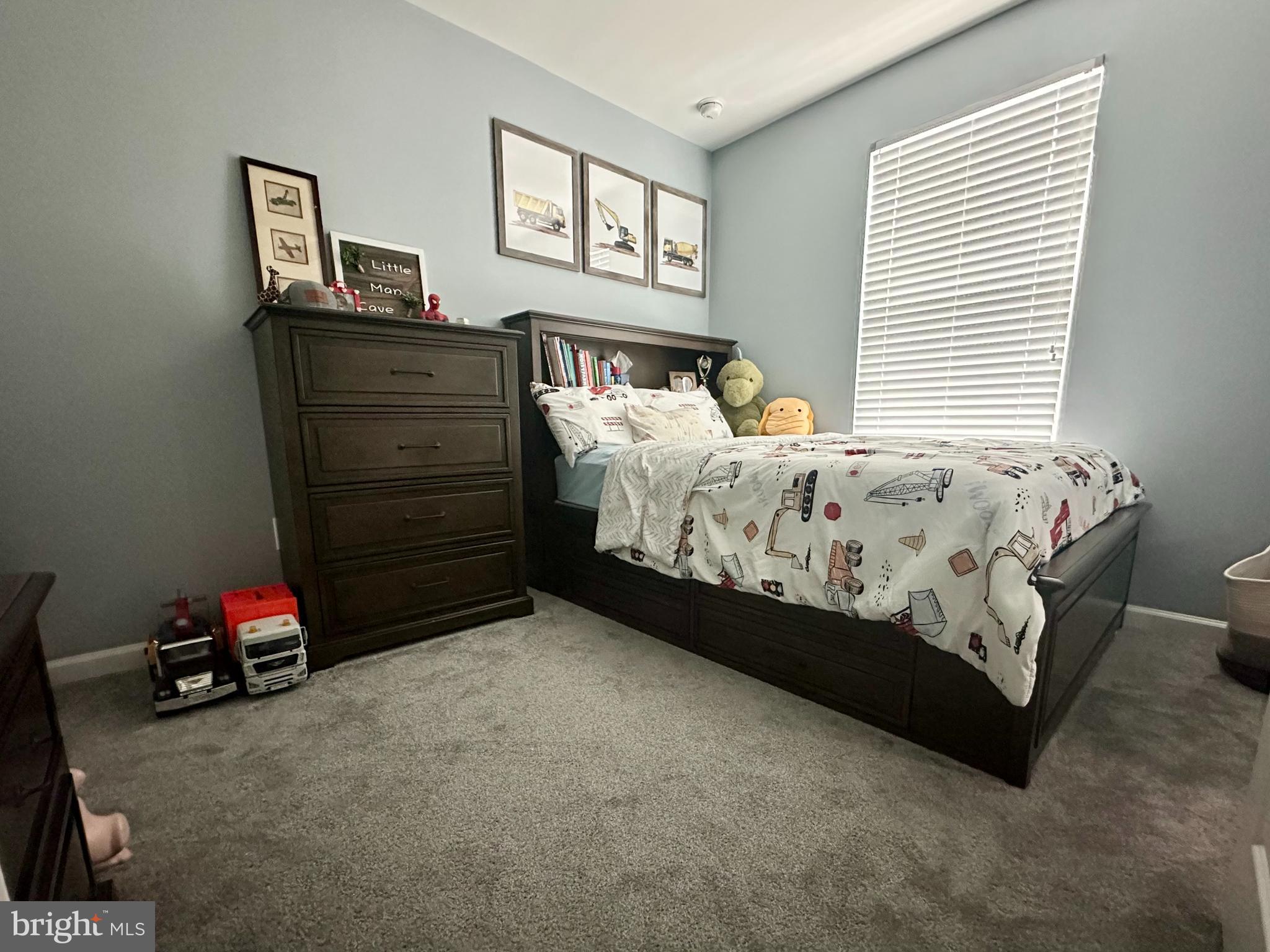 1043 Regency Place Sewell, NJ 08080 - Photo 18 of 24 a bed sitting in a bedroom next to a window
