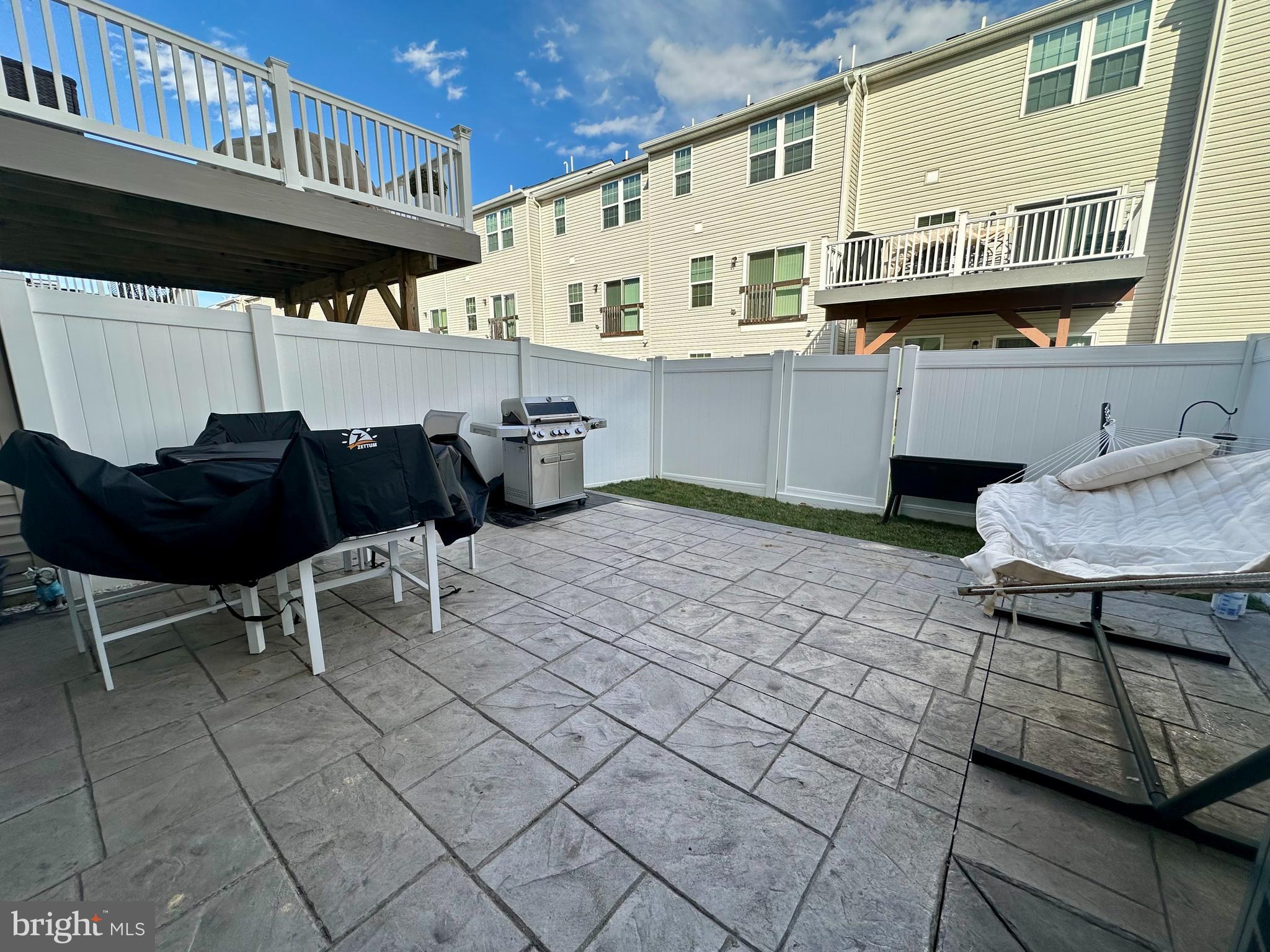 1043 Regency Place Sewell, NJ 08080 - Photo 23 of 24 a view of a chairs and table in the back yard