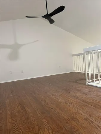 a view of a room with wooden floor