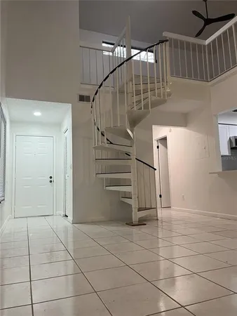 a view of entryway with stairs