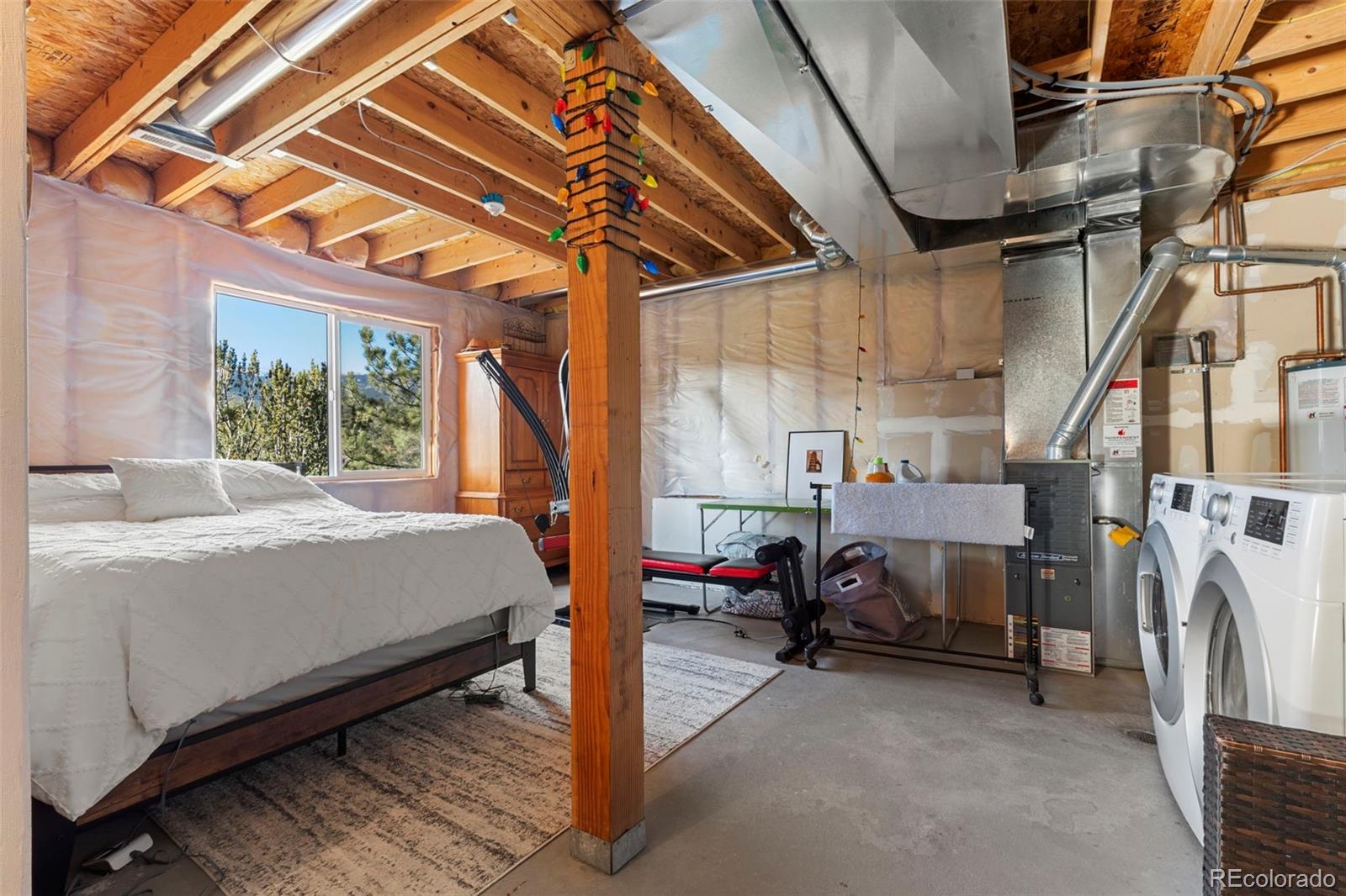 114 Hall Road Bailey, CO 80421 - Photo 14 of 21 a bed room with a bed and a balcony