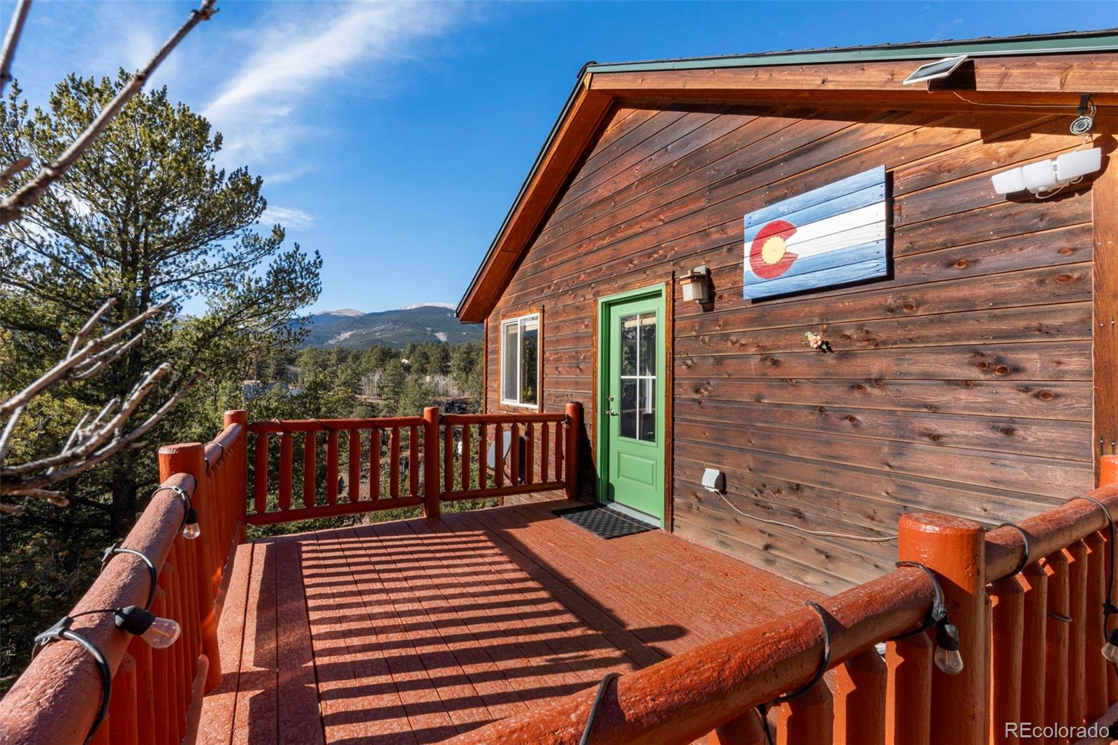 114 Hall Road Bailey, CO 80421 - Photo 3 of 21 a view of deck with wooden floor and outdoor seating