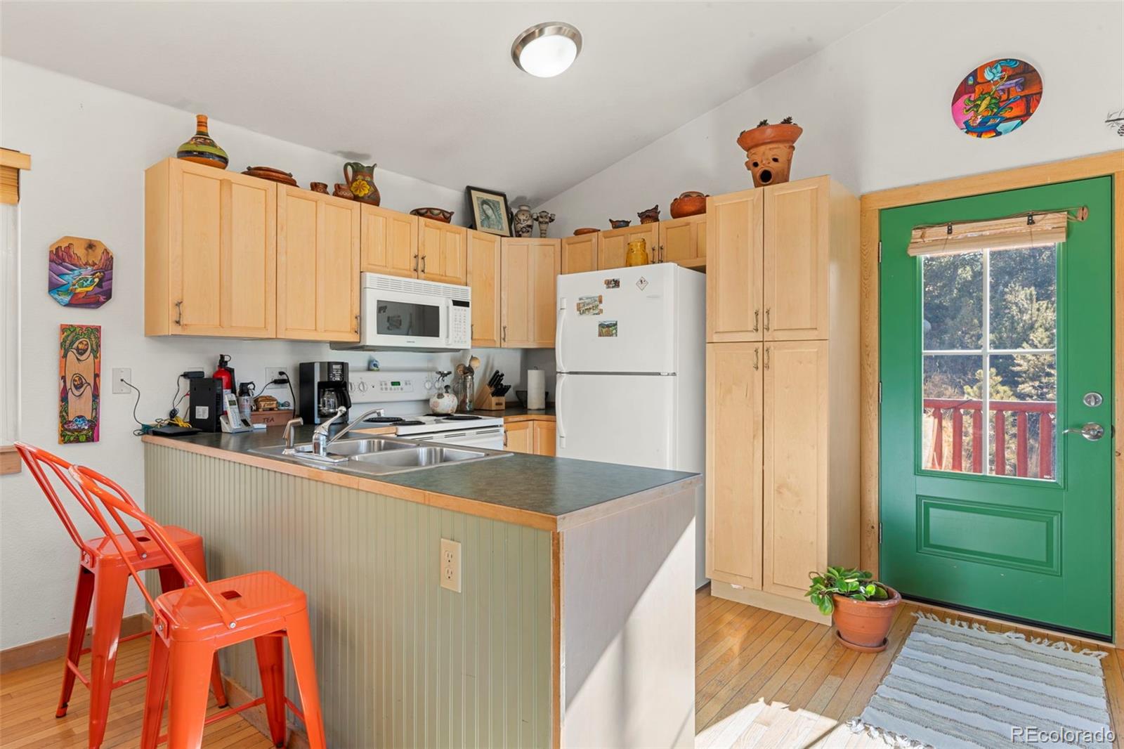 114 Hall Road Bailey, CO 80421 - Photo 8 of 21 a kitchen with stainless steel appliances granite countertop a refrigerator and a stove