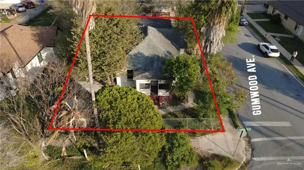 an aerial view of residential house with outdoor space and parking