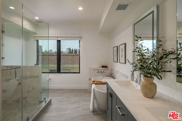 a view of bathroom with dual sinks