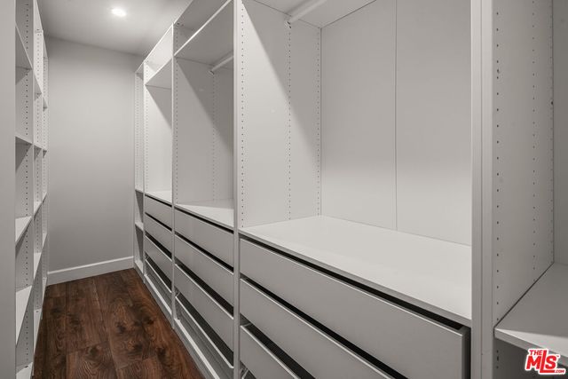 a view of an empty walk in closet