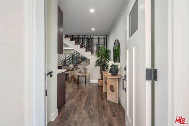 a view of entryway with wooden floor