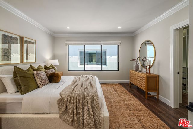 a bed room with a bed and a window