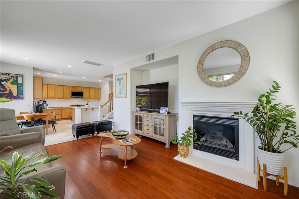 3819 St Austell Way Perris, CA 92571 - Photo 21 of 64 a living room with furniture fireplace and flat screen tv