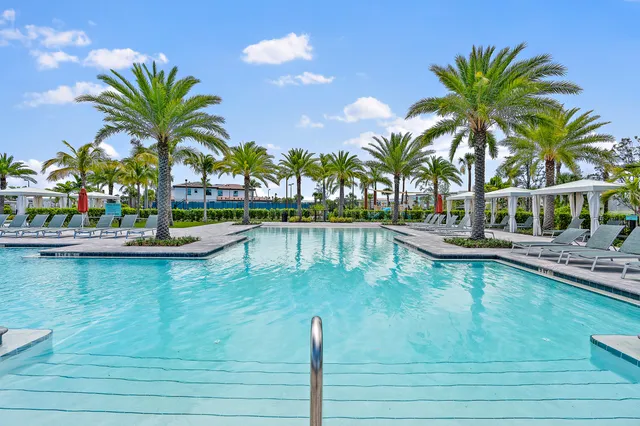a view of a swimming pool with a table and chairs