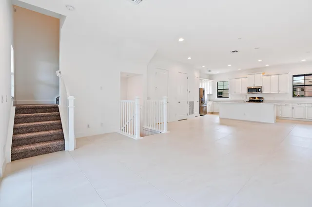 a view of a kitchen with a sink and a stove top oven