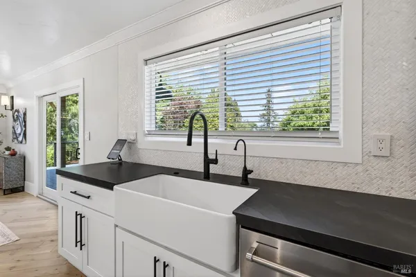a bathroom with a double vanity sink mirror and