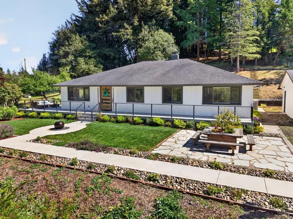 a backyard of a house with seating space