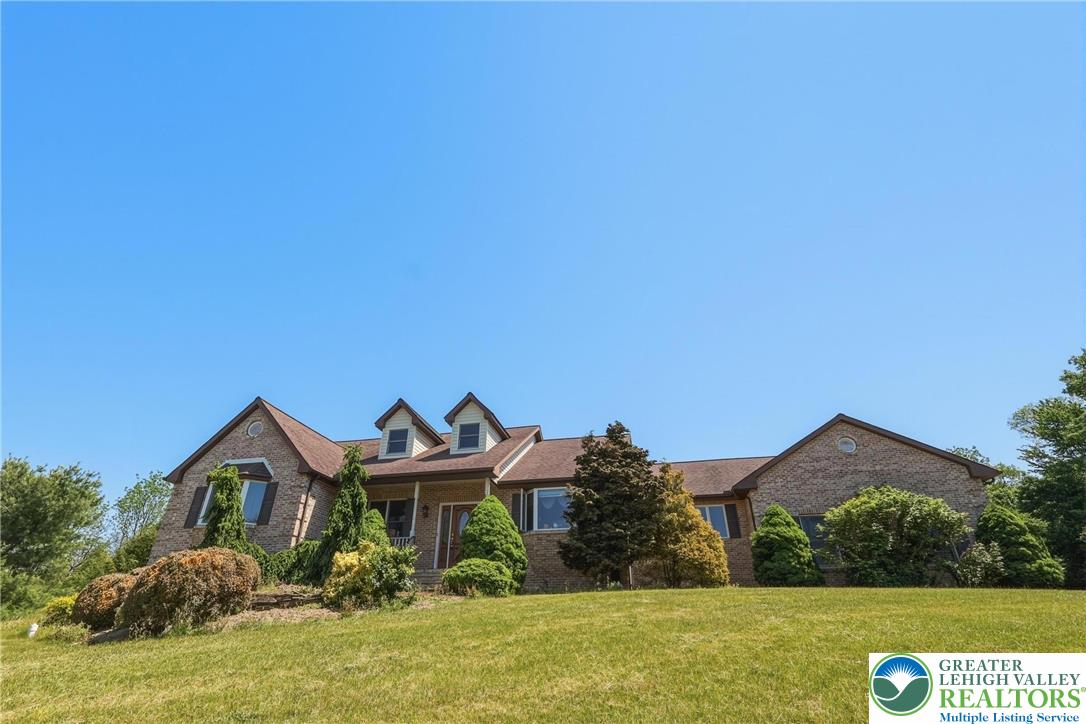 5217 Cider Press Road Schnecksville, PA 18078 - Photo 2 of 54 a front view of a house with a yard