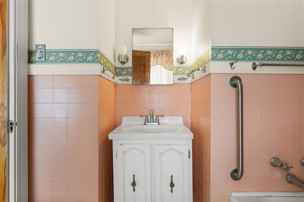1645 Charlton Heights Road Coraopolis, PA 15108 - Photo 20 of 49 a bathroom with a sink a mirror and shower