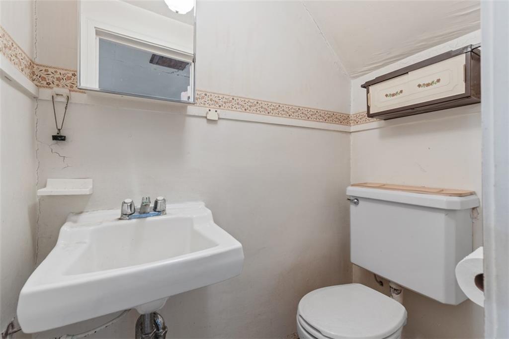 1645 Charlton Heights Road Coraopolis, PA 15108 - Photo 26 of 49 a bathroom with a sink toilet and a mirror