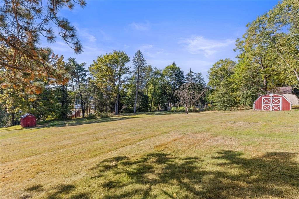 1645 Charlton Heights Road Coraopolis, PA 15108 - Photo 38 of 49 a view of empty space with swimming pool and trees in the background