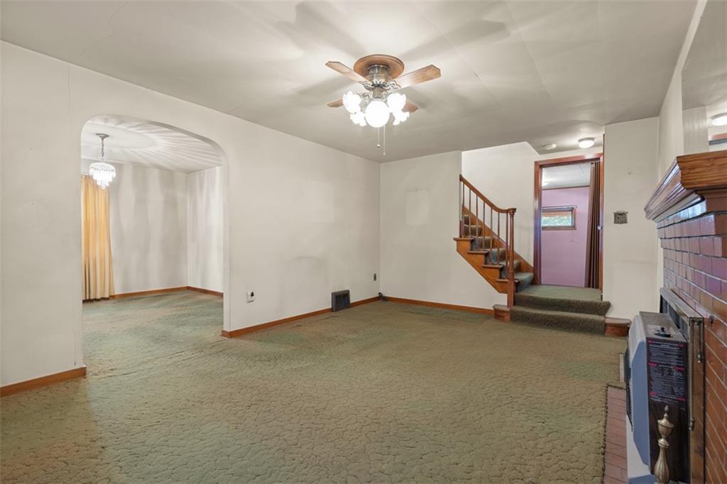 1645 Charlton Heights Road Coraopolis, PA 15108 - Photo 6 of 49 an empty room with fan and windows