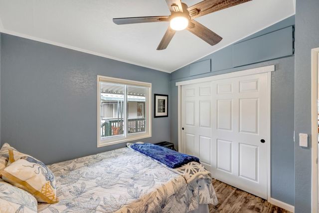 a bedroom with a large bed and a window