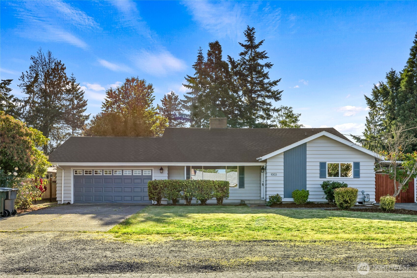 1003 9th Street Northwest Puyallup, WA 98371 - Photo 1 of 40 a view of a house with swimming pool and a yard