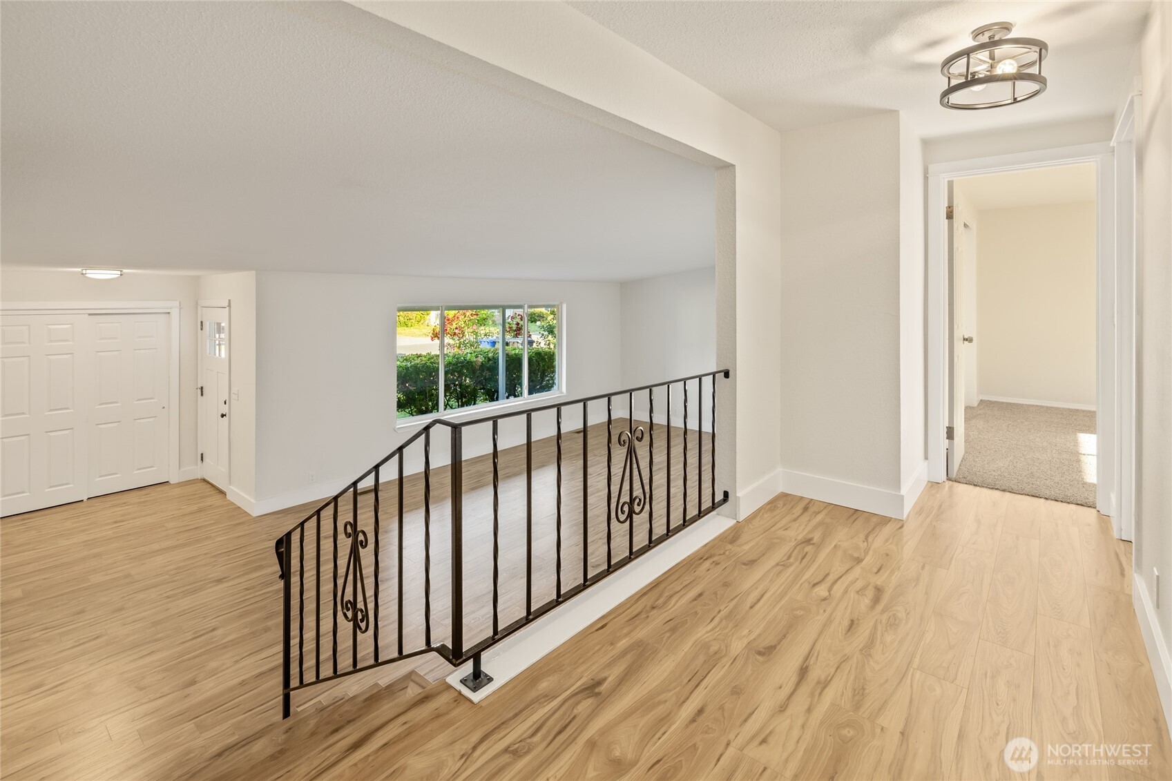 1003 9th Street Northwest Puyallup, WA 98371 - Photo 15 of 40 a view of a hallway with wooden floor