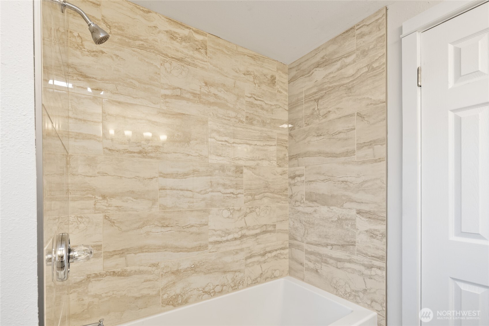 1003 9th Street Northwest Puyallup, WA 98371 - Photo 21 of 40 a bathroom with a shower