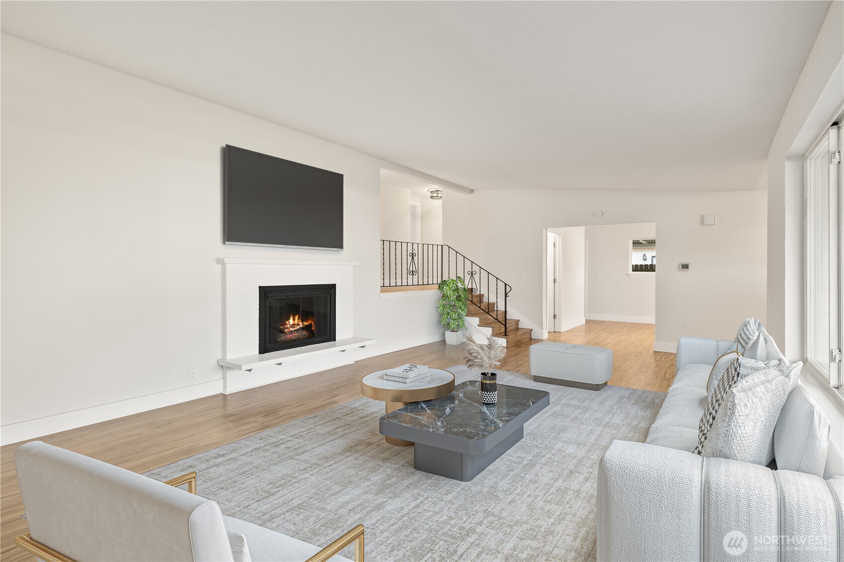 1003 9th Street Northwest Puyallup, WA 98371 - Photo 7 of 40 a living room with furniture and a fireplace