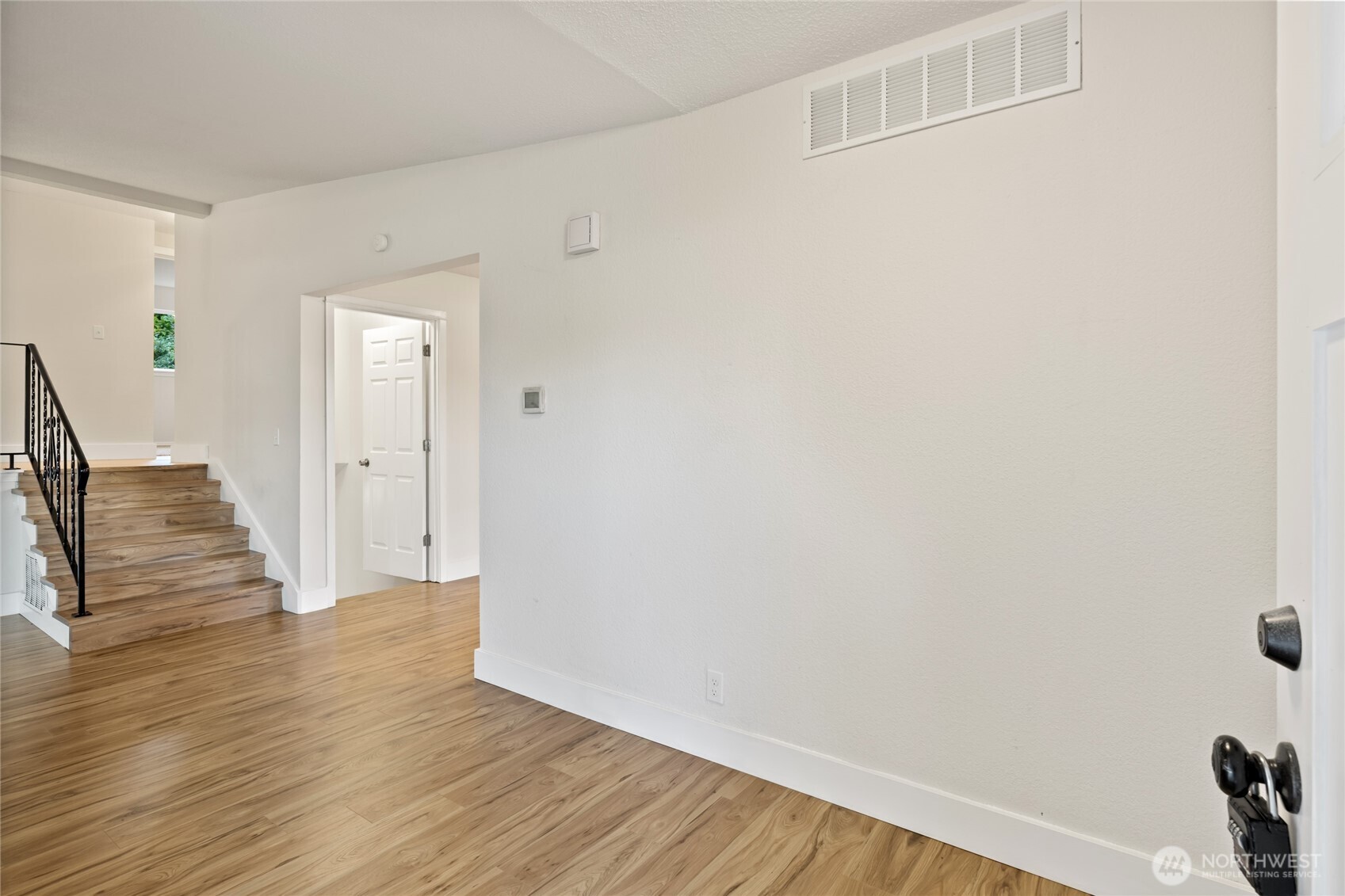 1003 9th Street Northwest Puyallup, WA 98371 - Photo 9 of 40 a view of a livingroom with wooden floor