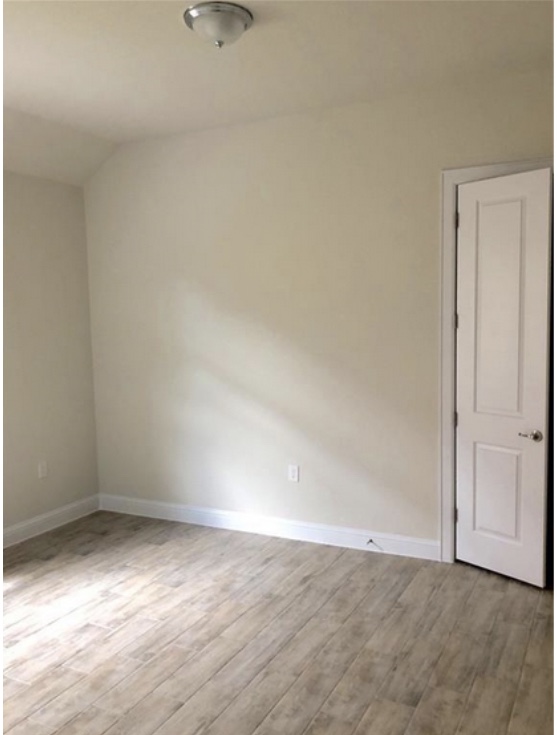 8813 Moccasin Path Austin, TX 78736 - Photo 7 of 10 Bedroom with light wood-style floors and lofted ceiling