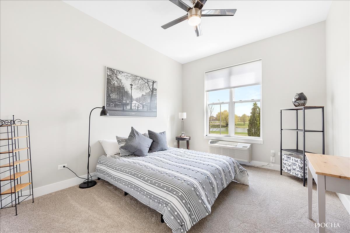 1101 Ritter Street, Unit 314 North Aurora, IL 60542 - Photo 7 of 11 a bedroom with a bed and a window