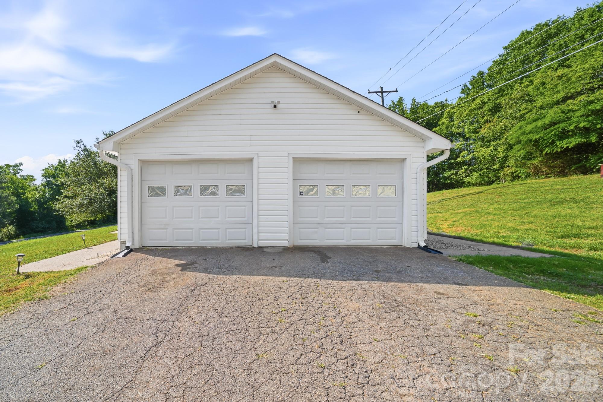 248 Jack McKinney Road Forest City, NC 28043 - Photo 5 of 29 a front view of a house with a yard and garage