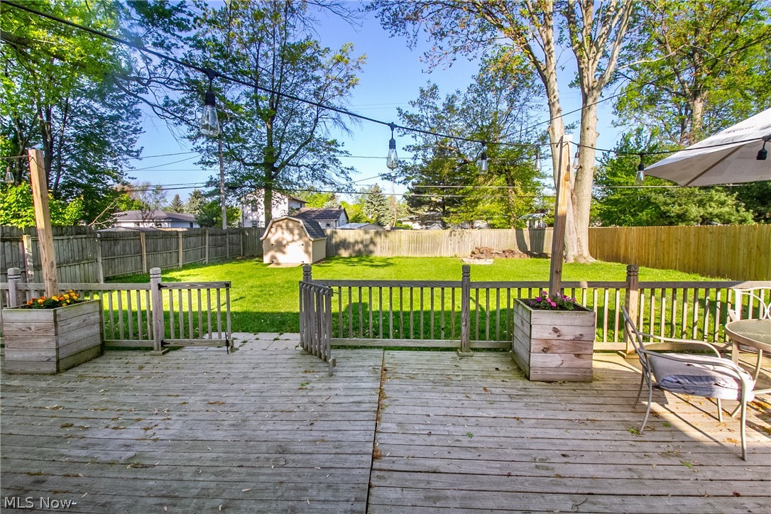 4796 Forest Road Mentor, OH 44060 - Photo 27 of 34 Wooden terrace featuring a storage shed and a lawn