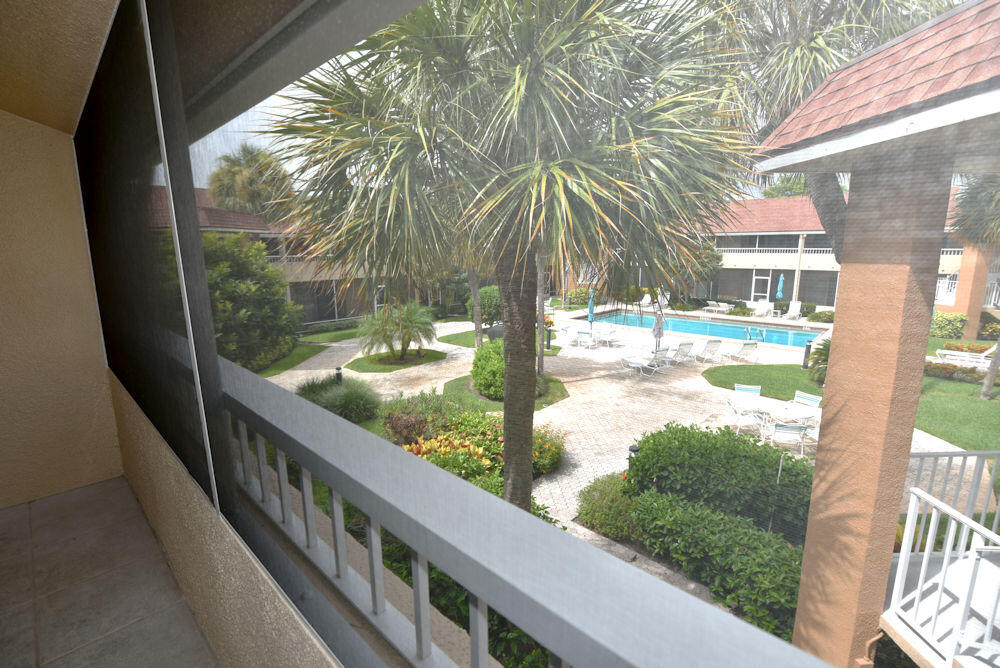 1100 Surf Road, Unit 202 Riviera Beach, FL 33404 - Photo 11 of 32 Screened out door patio