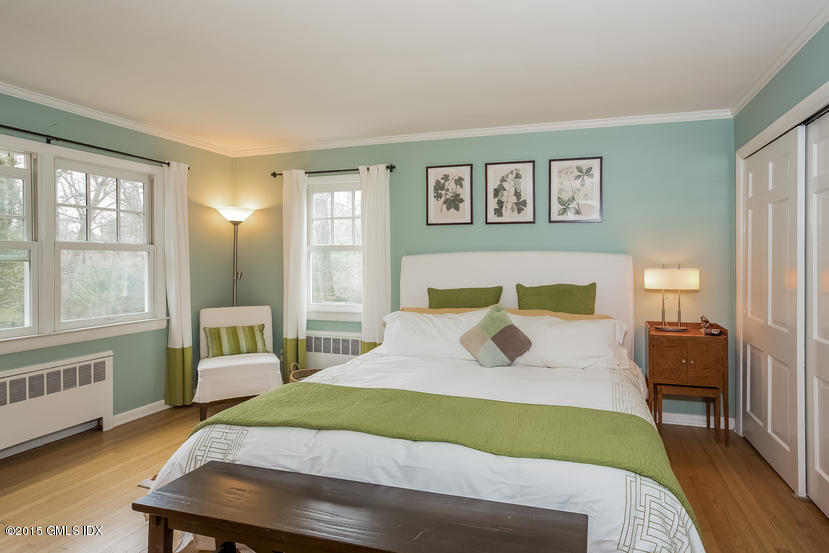 7 Anderson Road Greenwich, CT 06830 - Photo 12 of 23 a bedroom with a bed and wooden floor