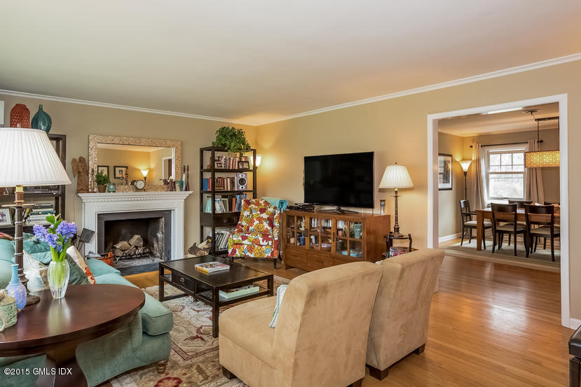 7 Anderson Road Greenwich, CT 06830 - Photo 3 of 23 a living room with furniture a flat screen tv and a fireplace