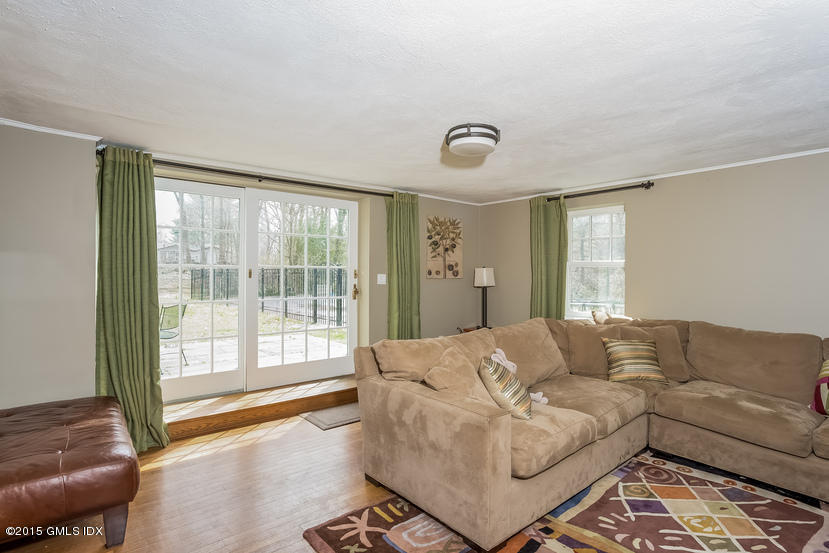 7 Anderson Road Greenwich, CT 06830 - Photo 8 of 23 a living room with furniture and a large window
