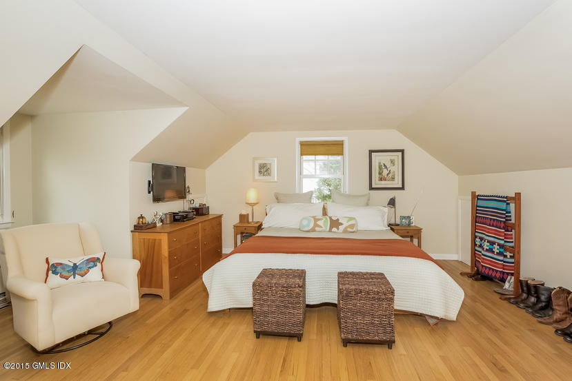 7 Anderson Road Greenwich, CT 06830 - Photo 9 of 23 a bedroom with a bed and wooden floor