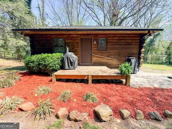 a view of a backyard with chairs
